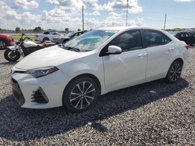 VIN 5YFBURHE9JP840982 2018 Toyota Corolla, L no.1