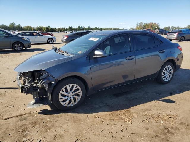 VIN 5YFBURHE5HP699967 2017 Toyota Corolla, L no.1