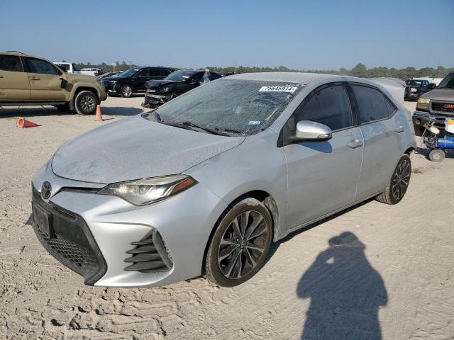 VIN 5YFBURHE0JP854057 2018 Toyota Corolla, L no.1