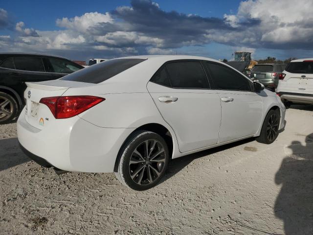 VIN 5YFBURHE2JP824509 2018 Toyota Corolla, L no.3