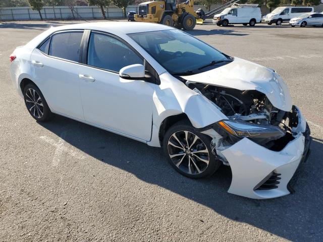 VIN 5YFBURHE9JP801759 2018 Toyota Corolla, L no.4