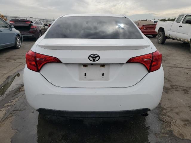 VIN 5YFBURHE5HP692775 2017 Toyota Corolla, L no.6