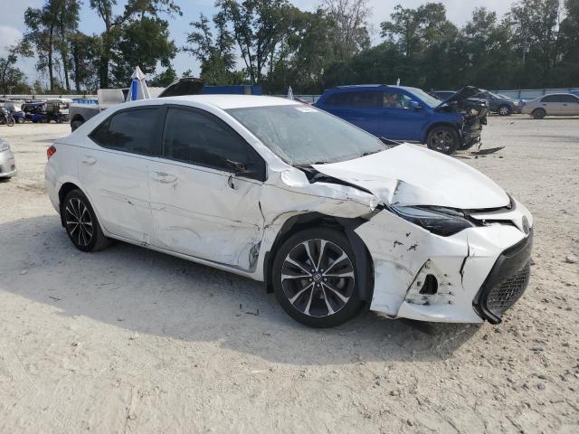 VIN 5YFBURHE8JP774716 2018 Toyota Corolla, L no.4