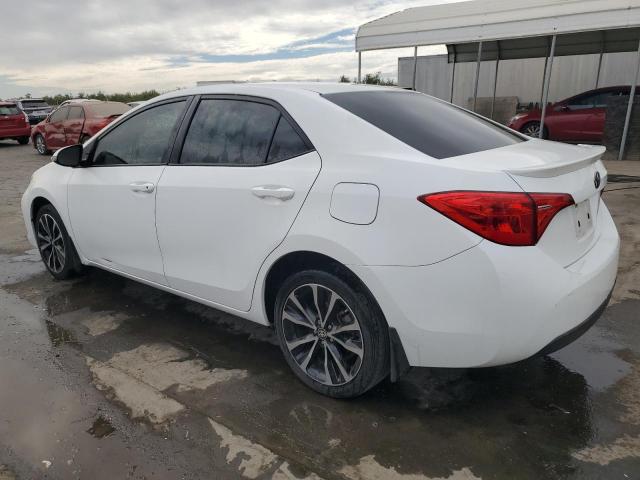 VIN 5YFBURHE5HP692775 2017 Toyota Corolla, L no.2