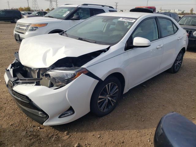 VIN 5YFBURHE9JP773574 2018 Toyota Corolla, L no.1