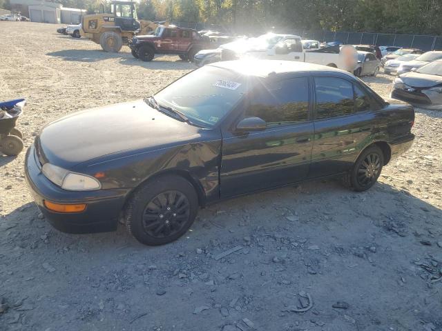 GEO PRIZM BASE 1995 black  gas 1Y1SK5261SZ077665 photo #1