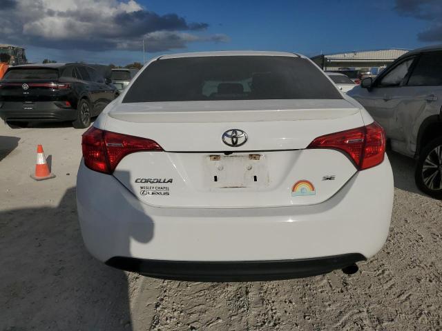 VIN 5YFBURHE2JP824509 2018 Toyota Corolla, L no.6