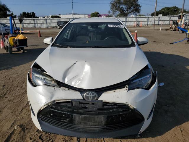 VIN 5YFBURHE6HP679789 2017 Toyota Corolla, L no.5