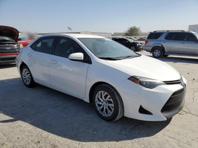 VIN 5YFBURHE9JP817573 2018 Toyota Corolla, L no.4