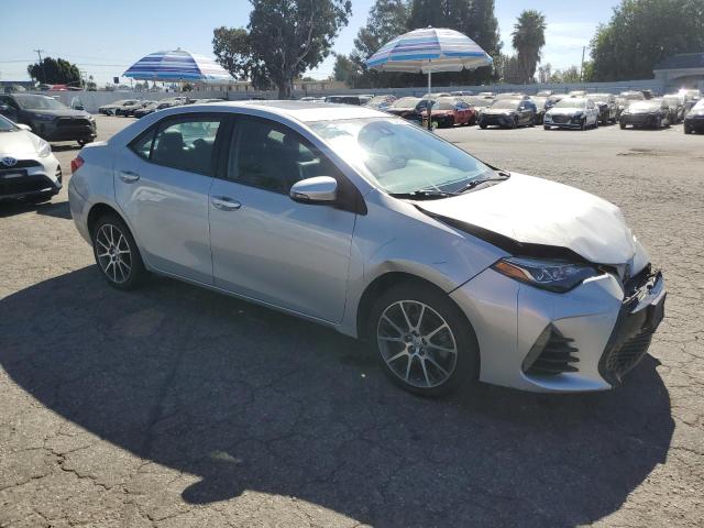 VIN 5YFBURHE7HP623697 2017 Toyota Corolla, L no.4