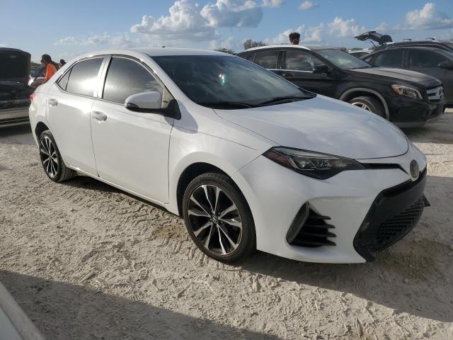 VIN 5YFBURHE2JP824509 2018 Toyota Corolla, L no.4