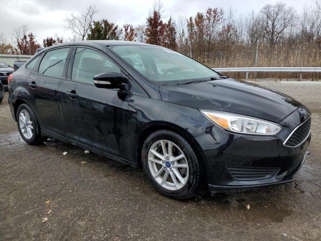 VIN 1FADP3F26HL335884 2017 Ford Focus, SE no.4