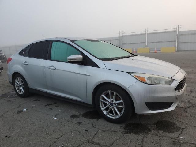 VIN 1FADP3F25FL281622 2015 FORD FOCUS no.4