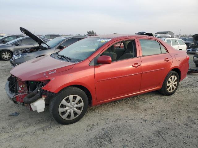 TOYOTA COROLLA BA 2009 red sedan 4d gas JTDBL40EX99033437 photo #1