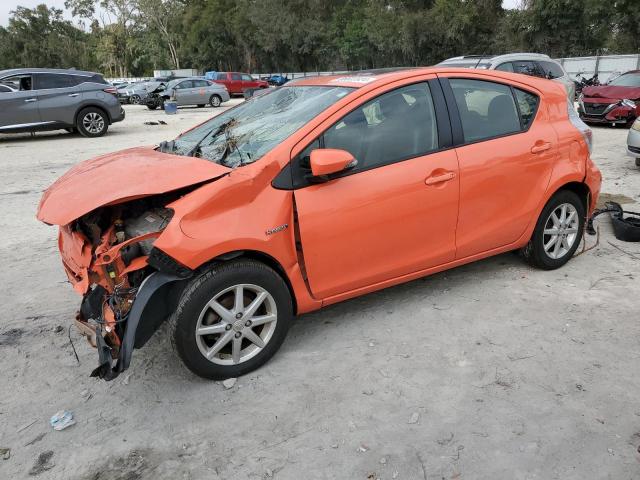 TOYOTA PRIUS C 2014 orange hatchbac hybrid engine JTDKDTB33E1081583 photo #1